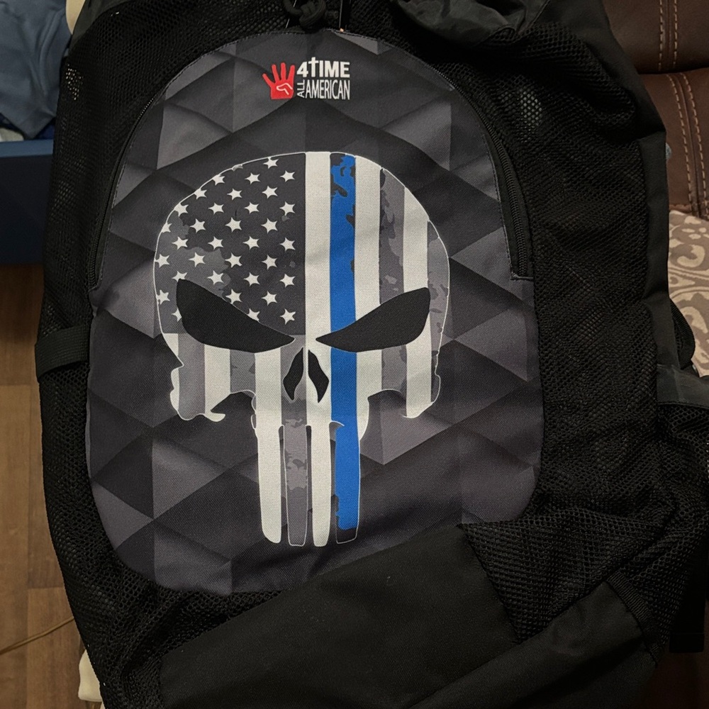 Black Backpack with Skull and Flag Design